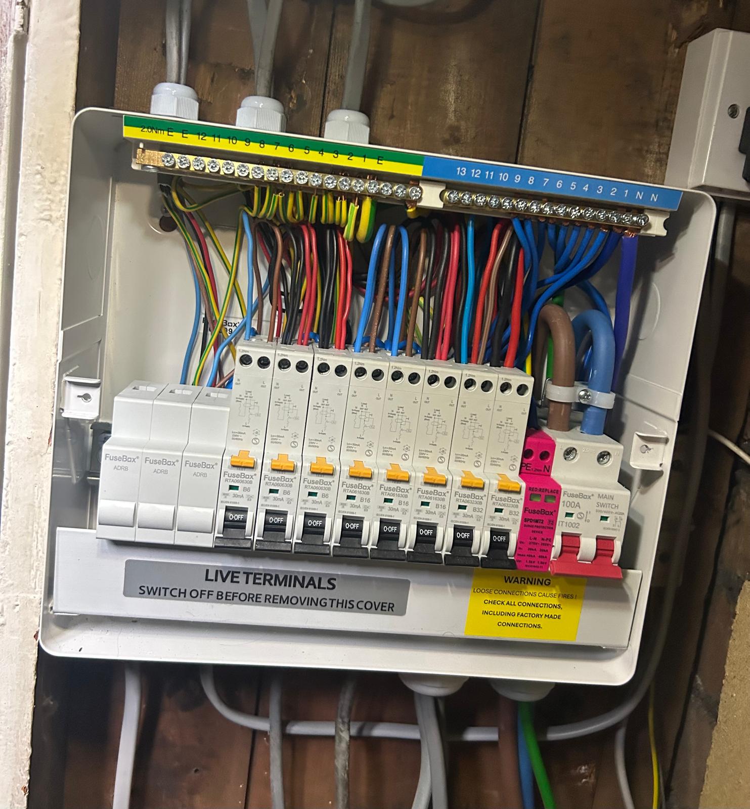 Neatly wired domestic consumer unit with labelled circuits